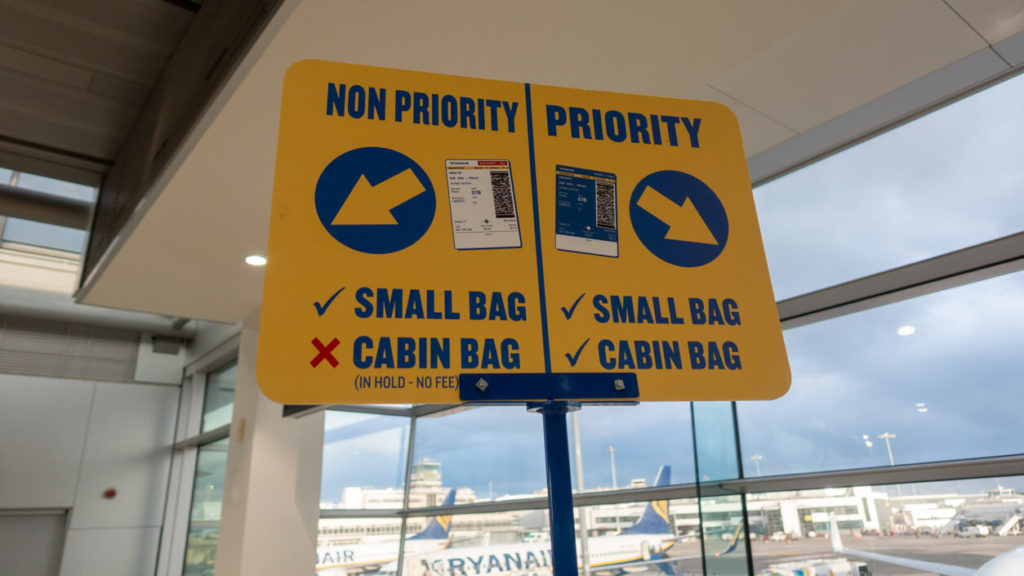 Ryanair priority and non priority sign at boarding gate